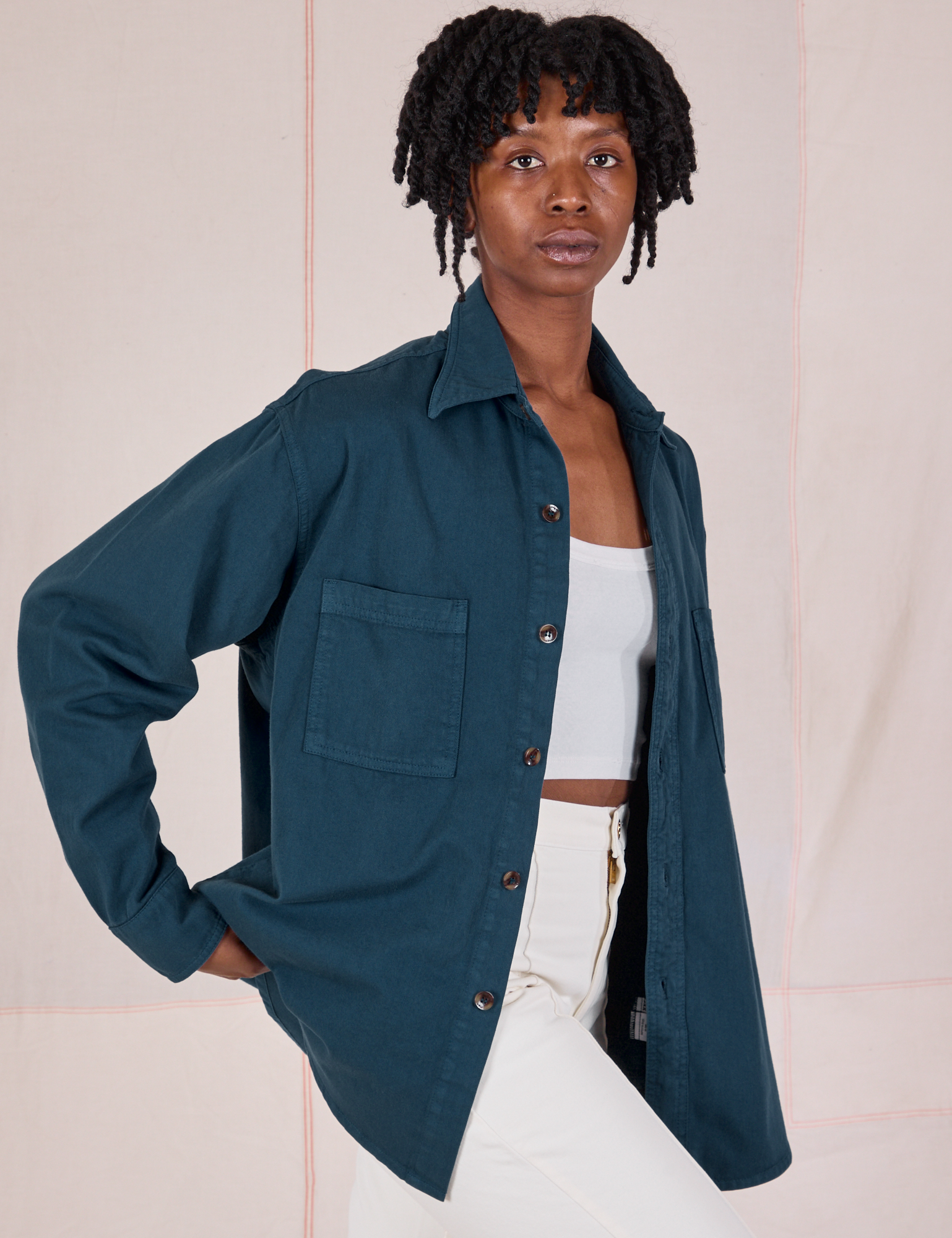 Angled front view of Twill Overshirt in Lagoon on Cheyann