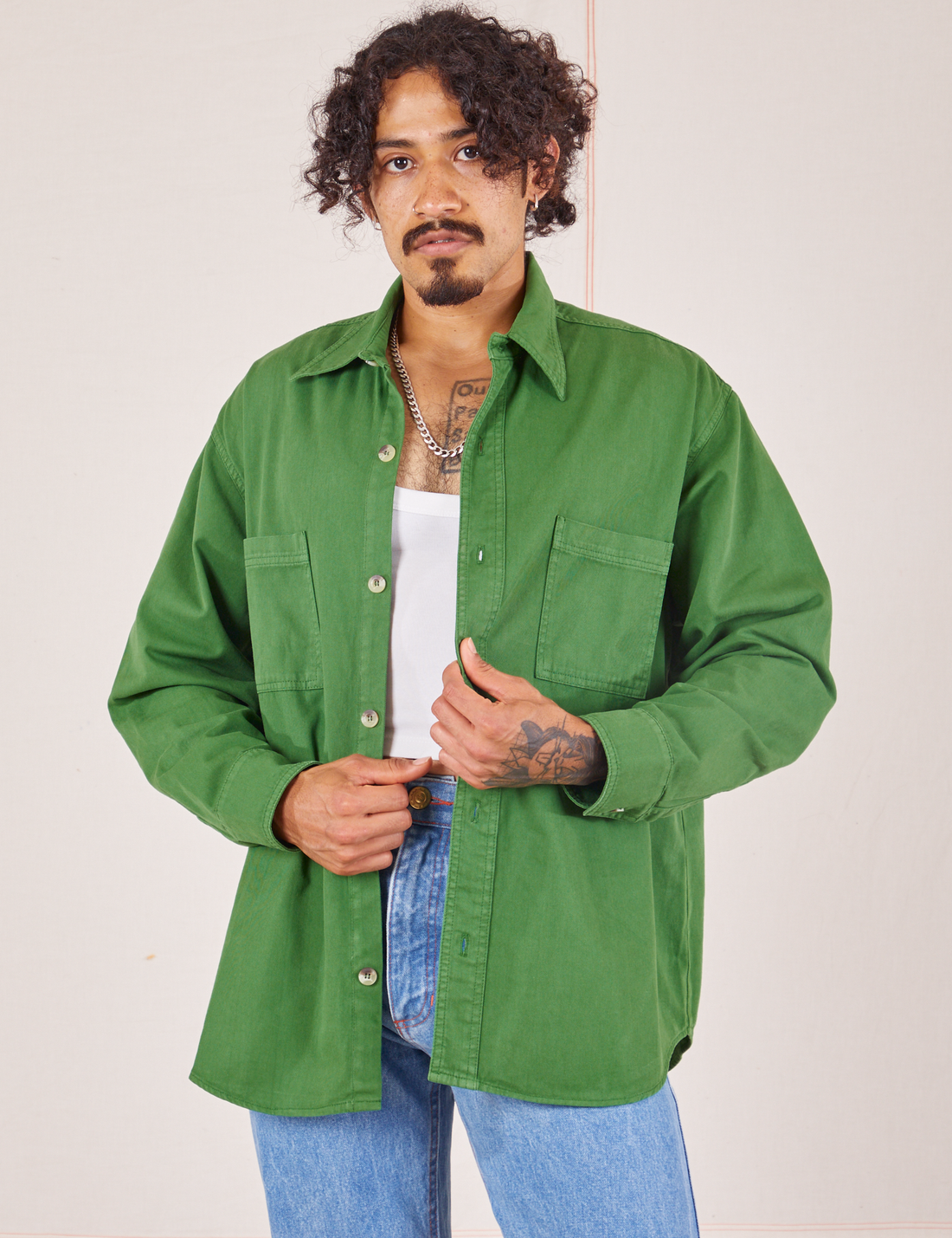 Jesse is wearing Oversize Overshirt in Lawn Green and vintage off-white Cropped Tank Top