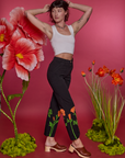 Angled front view of Paintstamped Work Pants in Poppy and Cropped Tank in Vintage Tee White on Alex