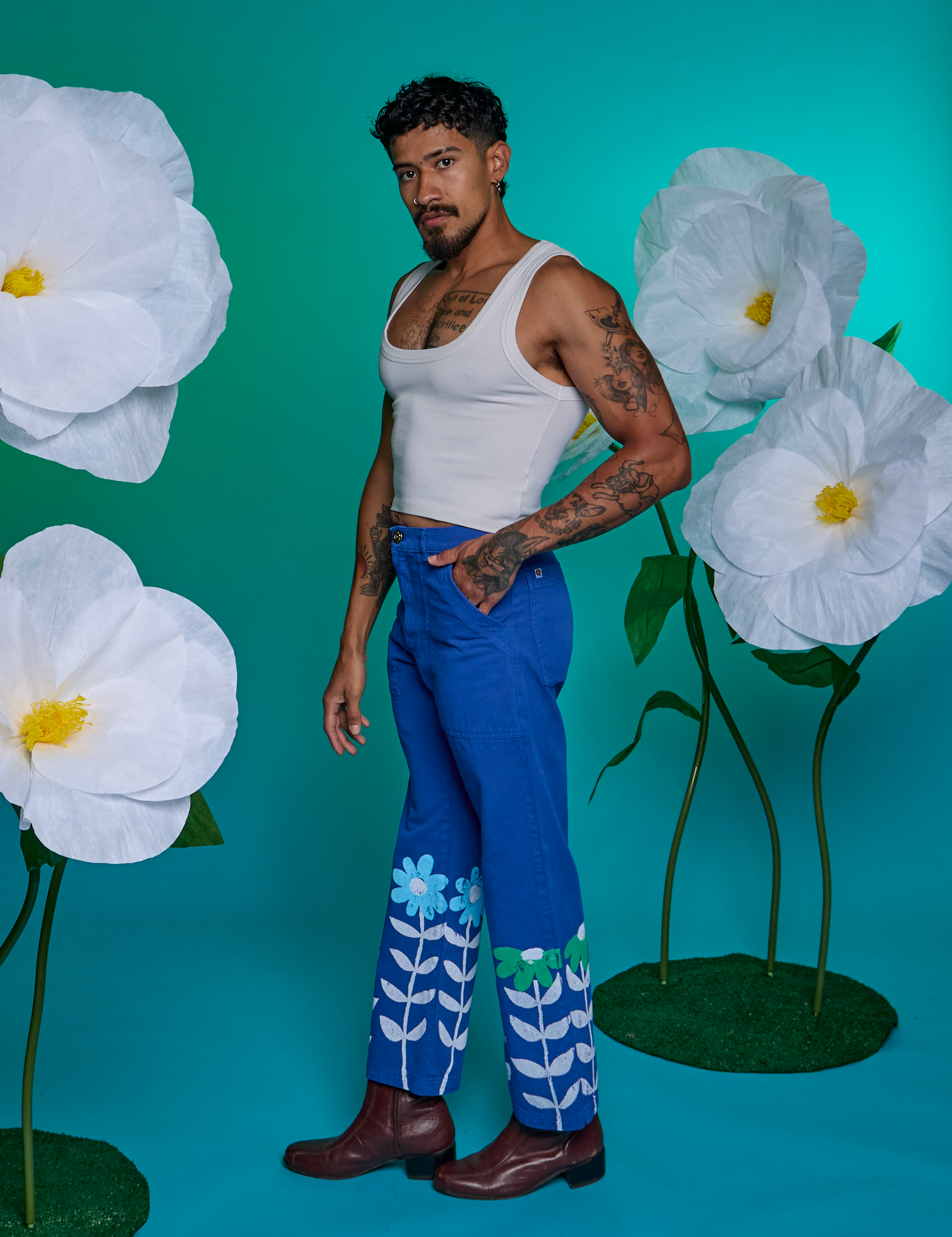 Side view of Paintstamped Work Pants in Daisy and Cropped Tank in Vintage Tee White on Jesse