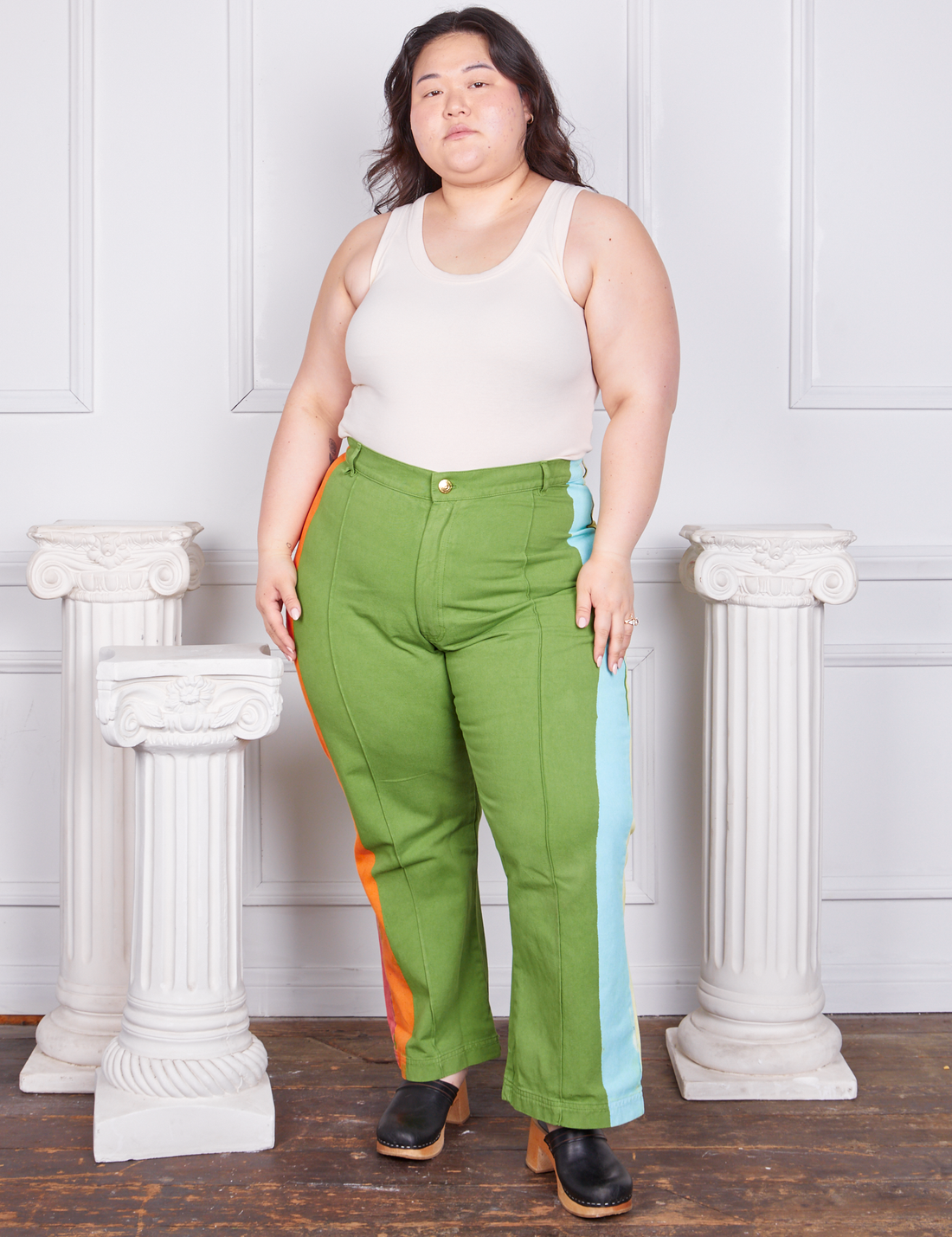 Ashley is wearing Hand-Painted Stripe Western Pants in Bright Olive and a vintage off-white Tank Top