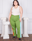 Ashley is wearing Hand-Painted Stripe Western Pants in Bright Olive and a vintage off-white Tank Top