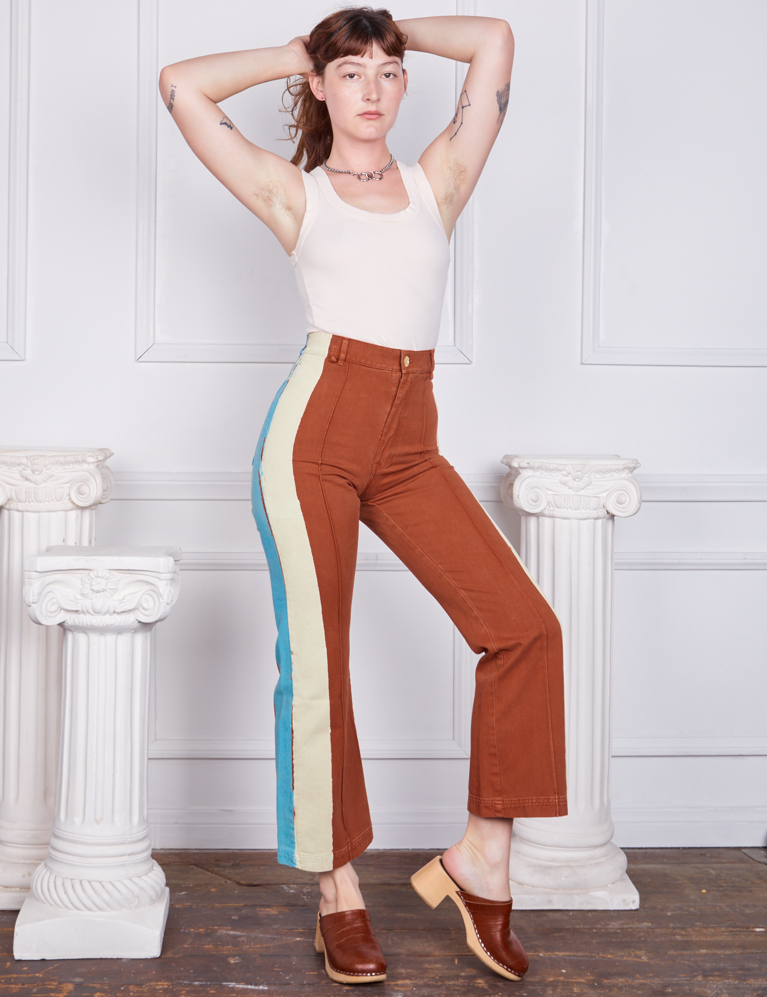 Hand-Painted Stripe Western Pants in Burnt Terracotta and vintage off-white Tank Top worn by Alex