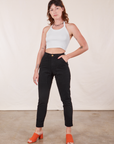 Alex is 5'8" and wearing XXS Pencil Pants in Basic Black paired with vintage off-white Halter Top