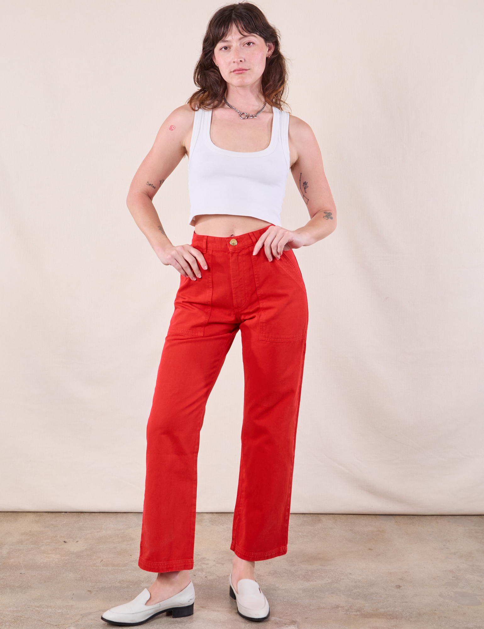 Alex is wearing Work Pants in Mustang Red and Cropped Tank in Vintage Tee Off-White