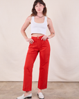 Alex is wearing Work Pants in Mustang Red and Cropped Tank in Vintage Tee Off-White