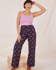 Tiara is 5'4" and wearing S Western Pants in Purple Tile Jacquard paired with bubblegum pink Cami