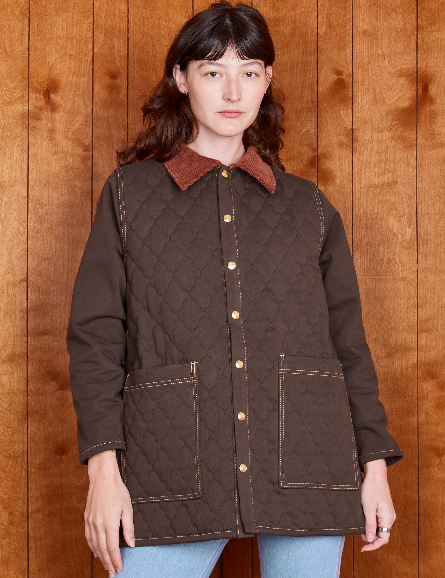 Alex is 5&#39;8&quot; and wearing P Quilted Overcoat in Espresso Brown
