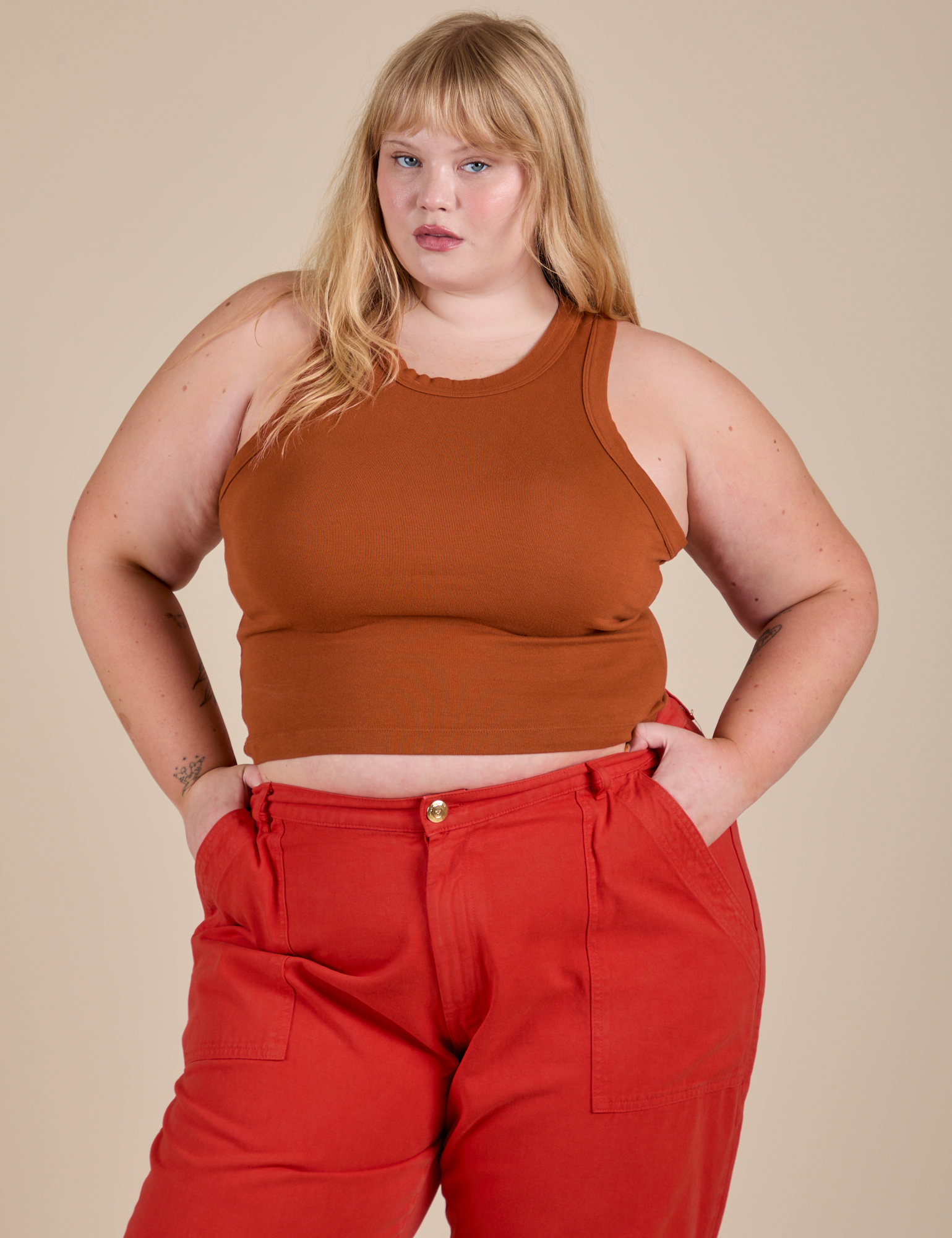 Juliet is wearing Racerback Tank in Burnt Terracotta