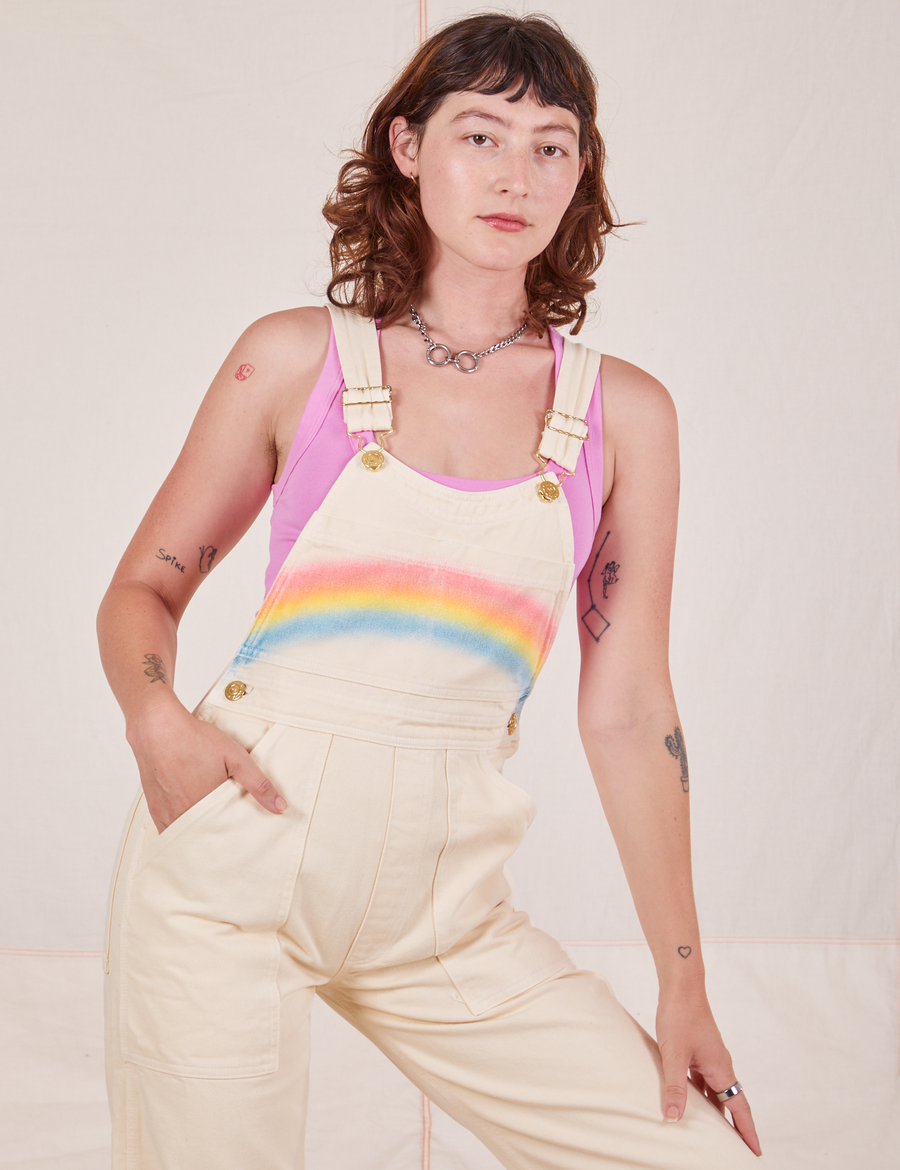 Alex is wearing Rainbow Overalls and bubblegum pink Cropped Tank Top