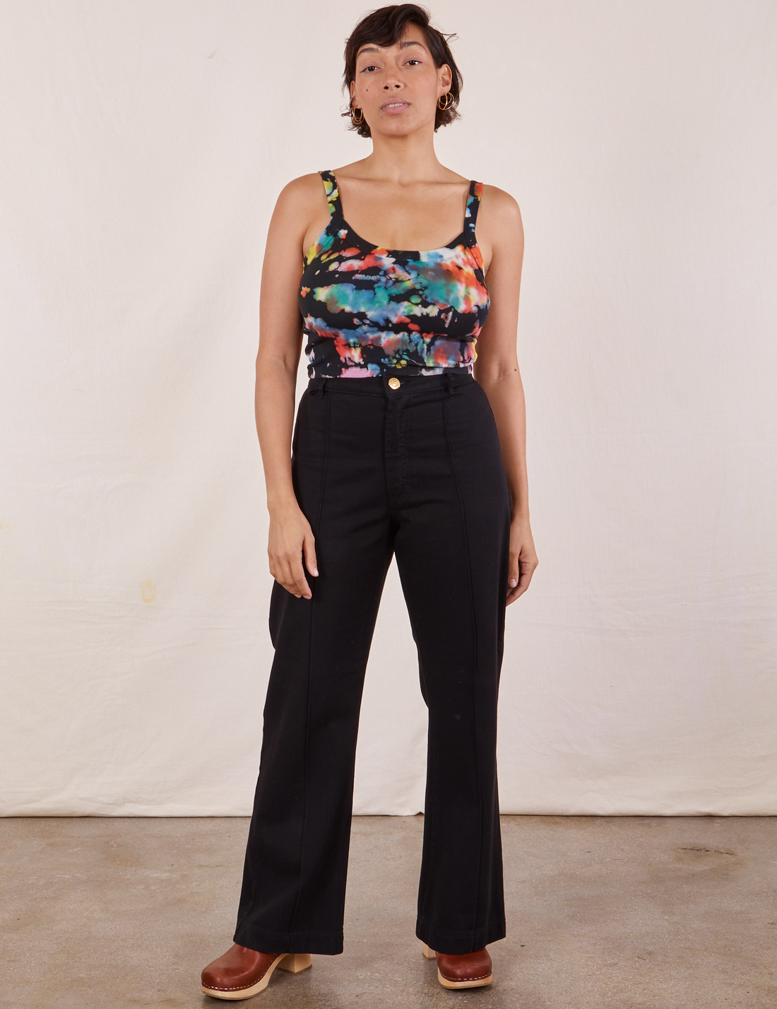 Tiara is wearing Cropped Cami in Rainbow Magic Waters and black Western Pants