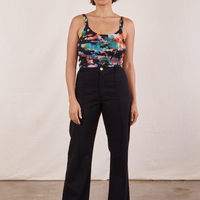 Tiara is wearing Cropped Cami in Rainbow Magic Waters and black Western Pants