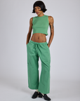 Kira is wearing Drop Pocket Cargo Pants in Seafoam Green and matching Muscle Tee