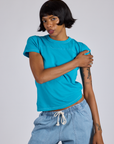 Kira is wearing Jr. Varsity Tee in Hawaiian Blue