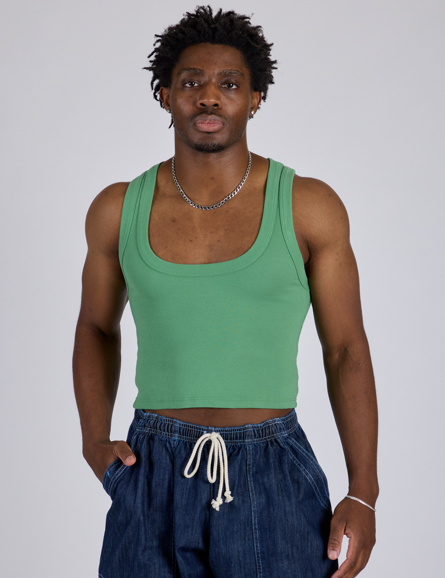 Isaac is 5’10” and wearing M Cropped Tank Top in Seafoam Green
