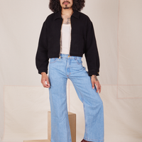 Ricky Jacket in Basic Black, vintage off-white Tank Top and light wash Sailor Jeans worn by Jesse