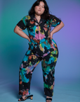 Ashley is wearing Short Sleeve Jumpsuit in Rainbow Magic Waters