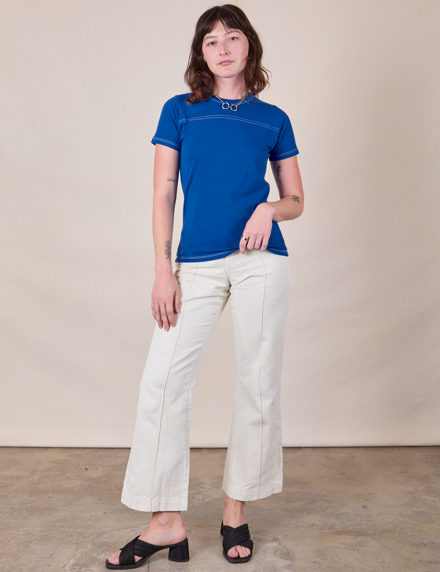 Alex is wearing JV Tee in Royal Blue paired with vintage tee off-white Western Pants