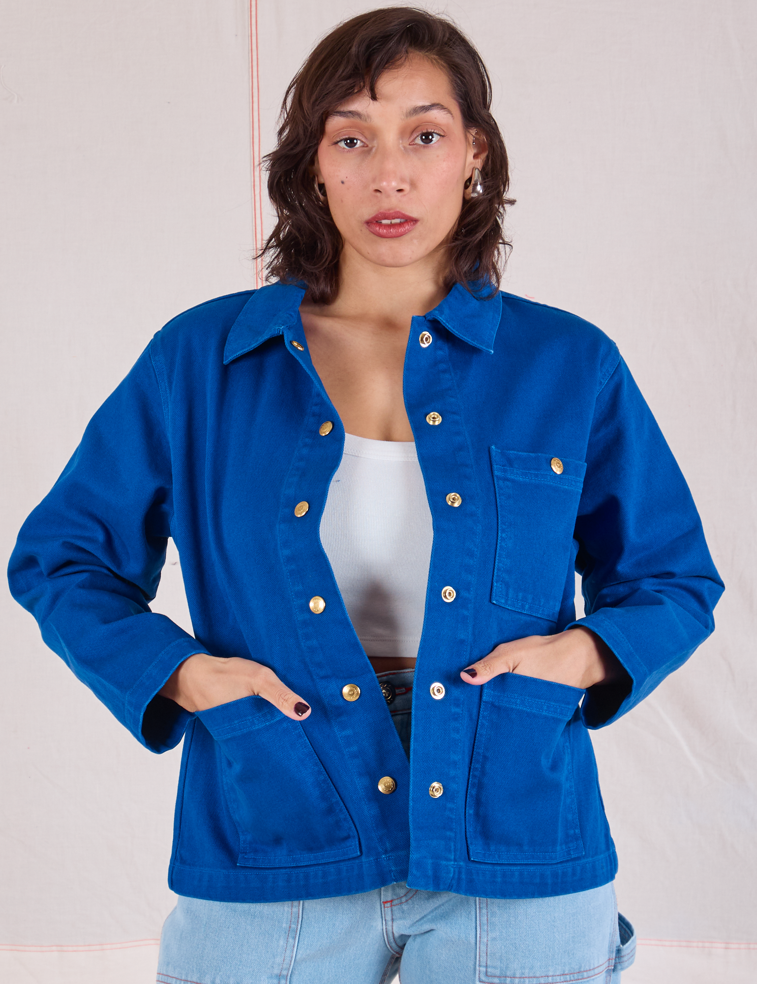 Tiara is 5'4" and wearing XS Denim Work Jacket in Royal Blue