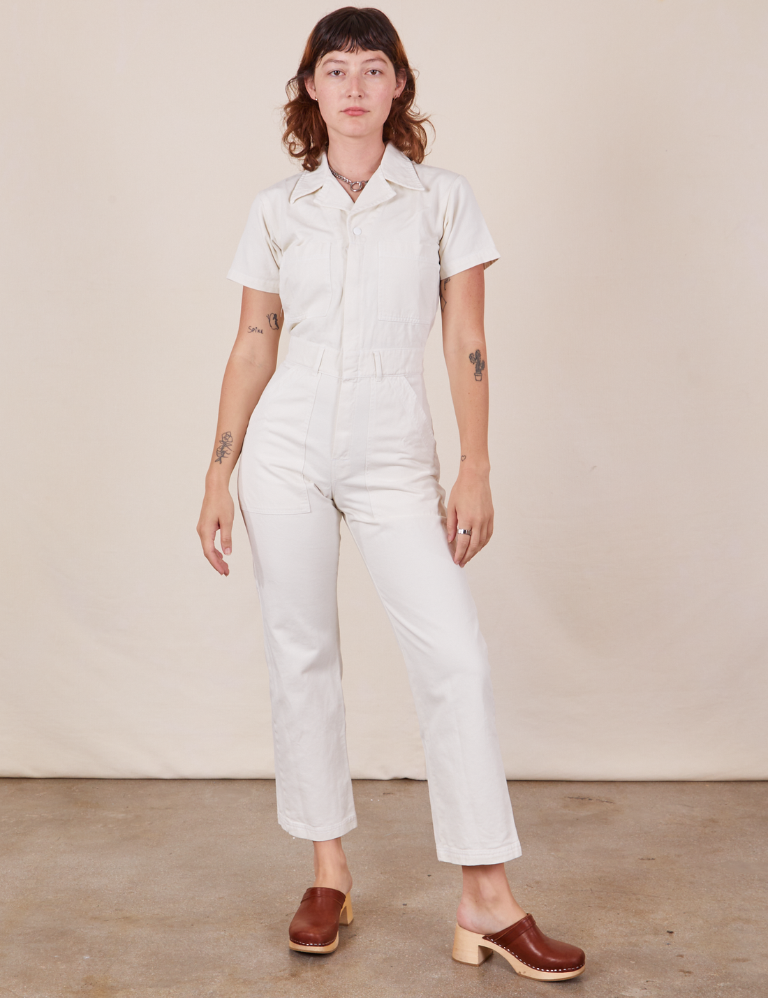 Alex is 5'8" and wearing XS Short Sleeve Jumpsuit in Vintage Tee Off-White