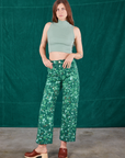 Scarlett is 5'9" and wearing XS Marble Splatter Work Pants in Hunter Green paired with sage green Sleeveless Turtleneck
