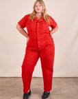 Juliet is 5'7" and wearing 1XL Short Sleeve Jumpsuit in Mustang Red