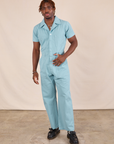 Issac is 5'10" and wearing M Short Sleeve Jumpsuit in Baby Blue