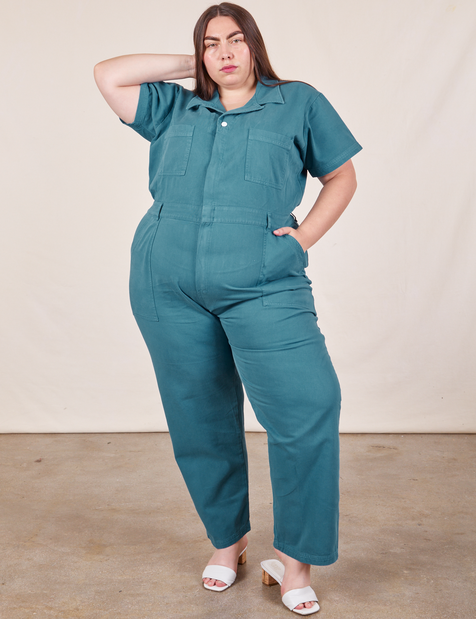 Marielena is wearing Short Sleeve Jumpsuit in Marine Blue