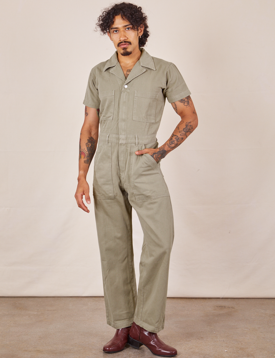 Jesse is wearing Short Sleeve Jumpsuit in Khaki Grey