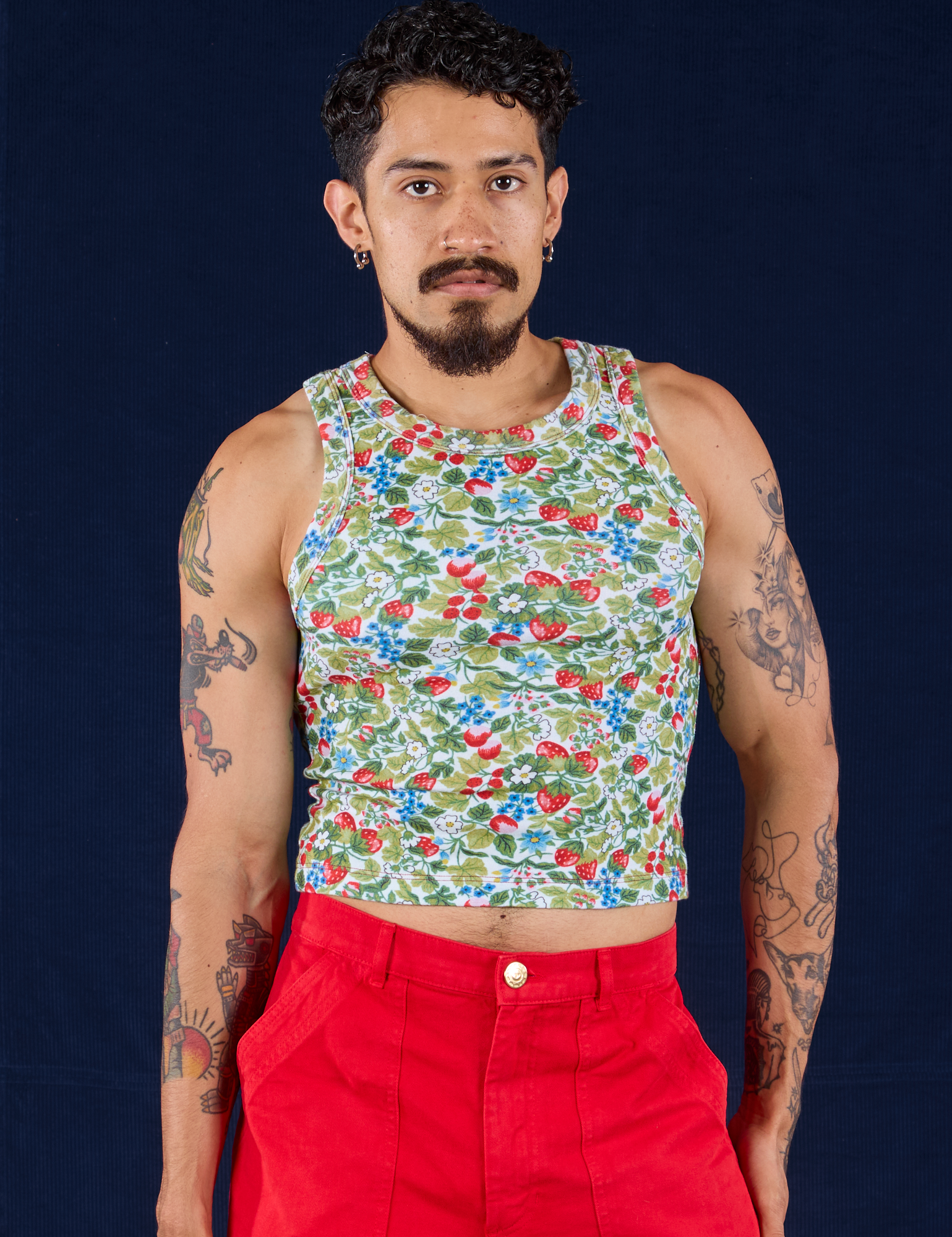 Jesse is 5'8" and wearing S Racerback Tank in Strawberry Blossom