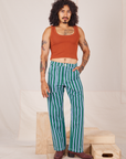 Jesse is 5'8" and wearing XS Stripe Work Pants in Green paired with burnt terracotta Cropped Tank