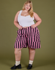 Juliet is wearing Longline Work Shorts in Bubblegum Pink and Cropped Tank in Vintage Tee White