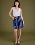 Alex is 5’8” and wearing XXS Longline Work Shorts in Cornflower paired with vintage tee white Cropped Tank