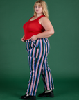 Side view of  Work Pants in Pacific Stripe and mustang red Cropped Tank on Juliet 