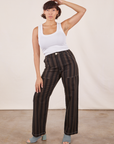 Tiara is wearing Black Striped Work Pants in Espresso and vintage off-white Tank Top