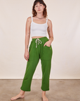 Alex is wearing Cropped Rolled Cuff Sweatpants in Lawn Green and vintage off-white Cami