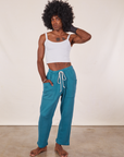 Jerrod is 6'3" and wearing M Cropped Rolled Cuff Sweatpants in Marine Blue paired with vintage off-white Cami