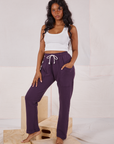 Kandia is wearing Rolled Cuff Sweat Pants in Nebula Purple and a Cropped Tank in vintage tee off-white 