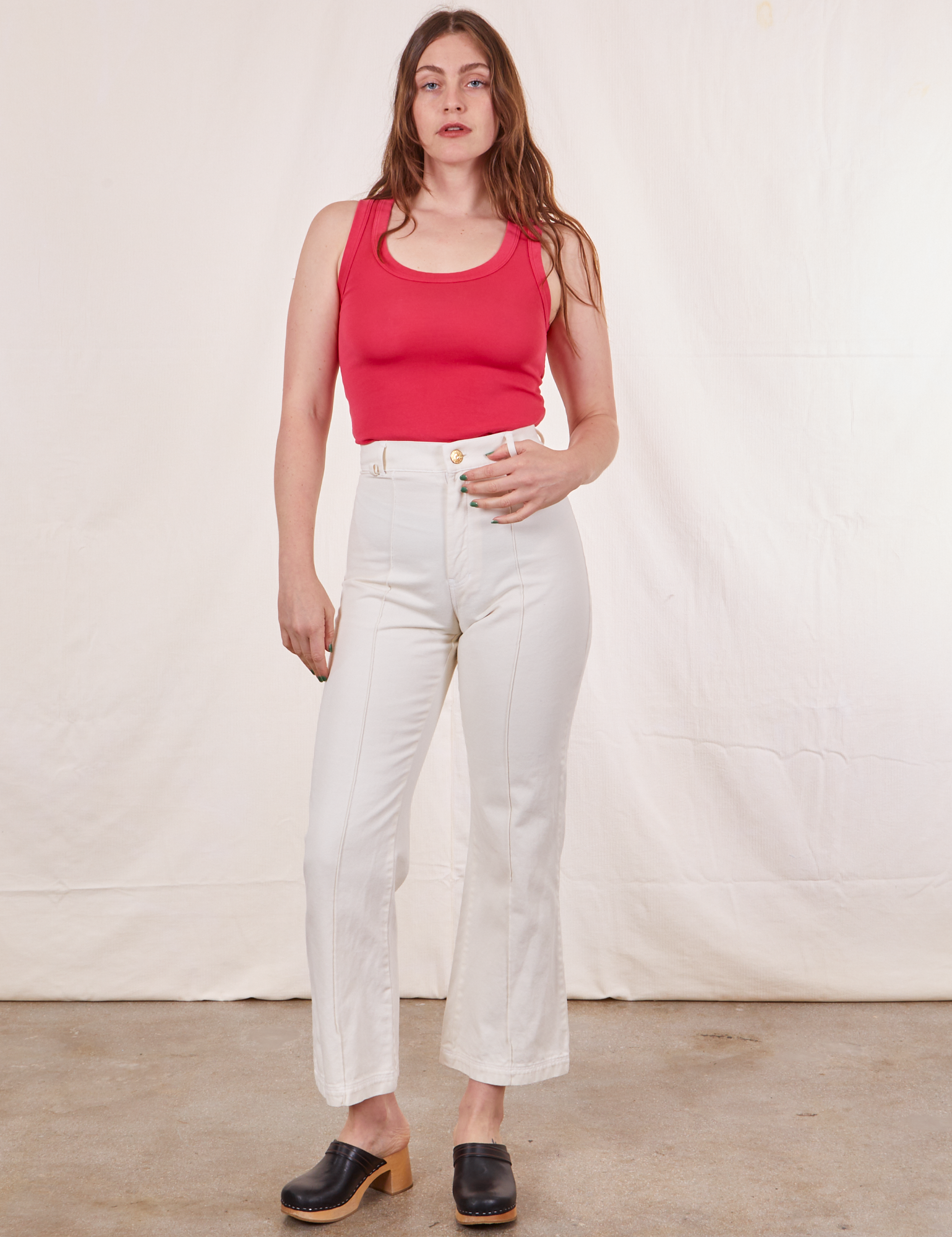 Allison is wearing Tank Top in Hot Pink and vintage off-white Western Pants