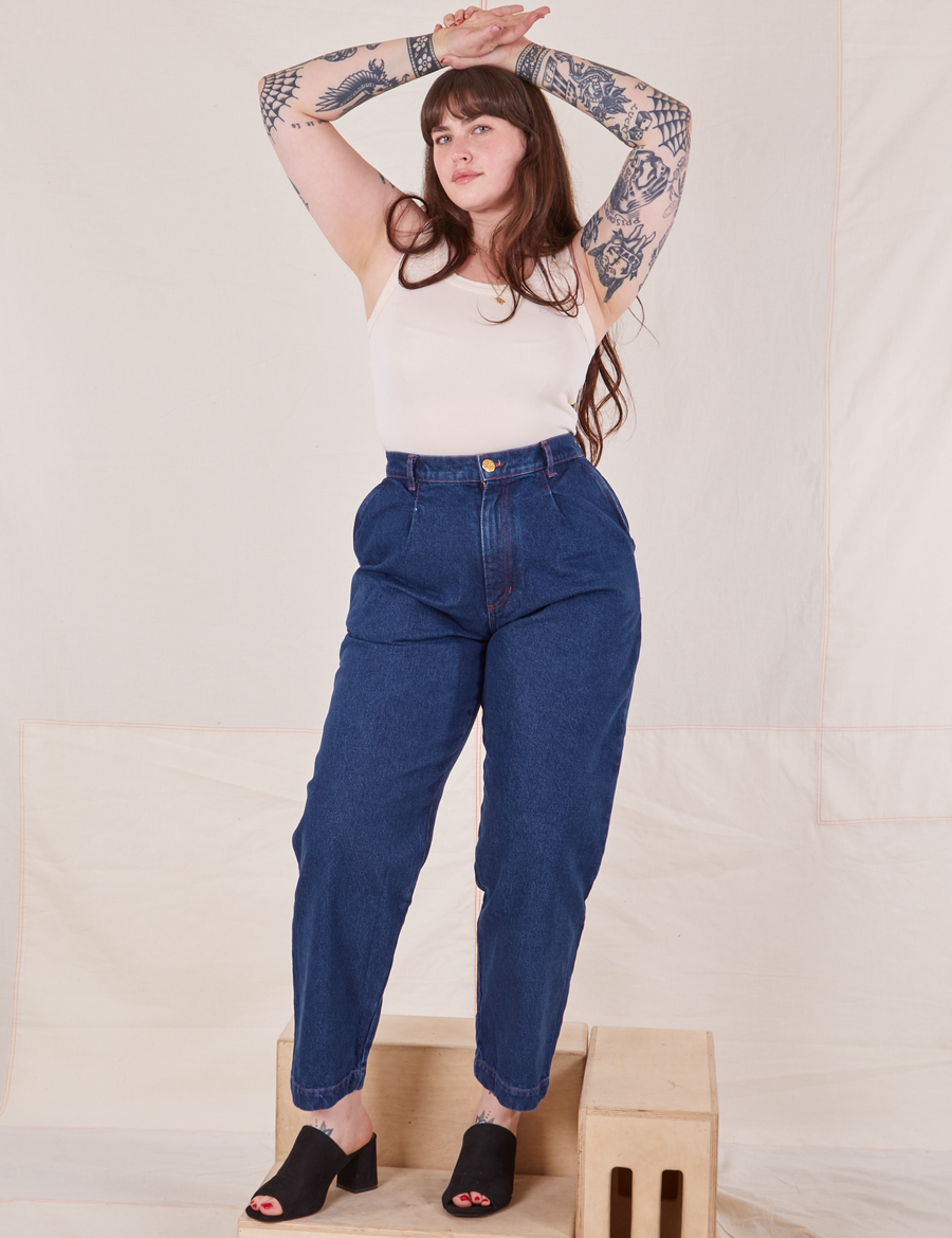 Sydney is wearing Denim Trouser Jeans in Dark Wash and vintage off-white Tank Top