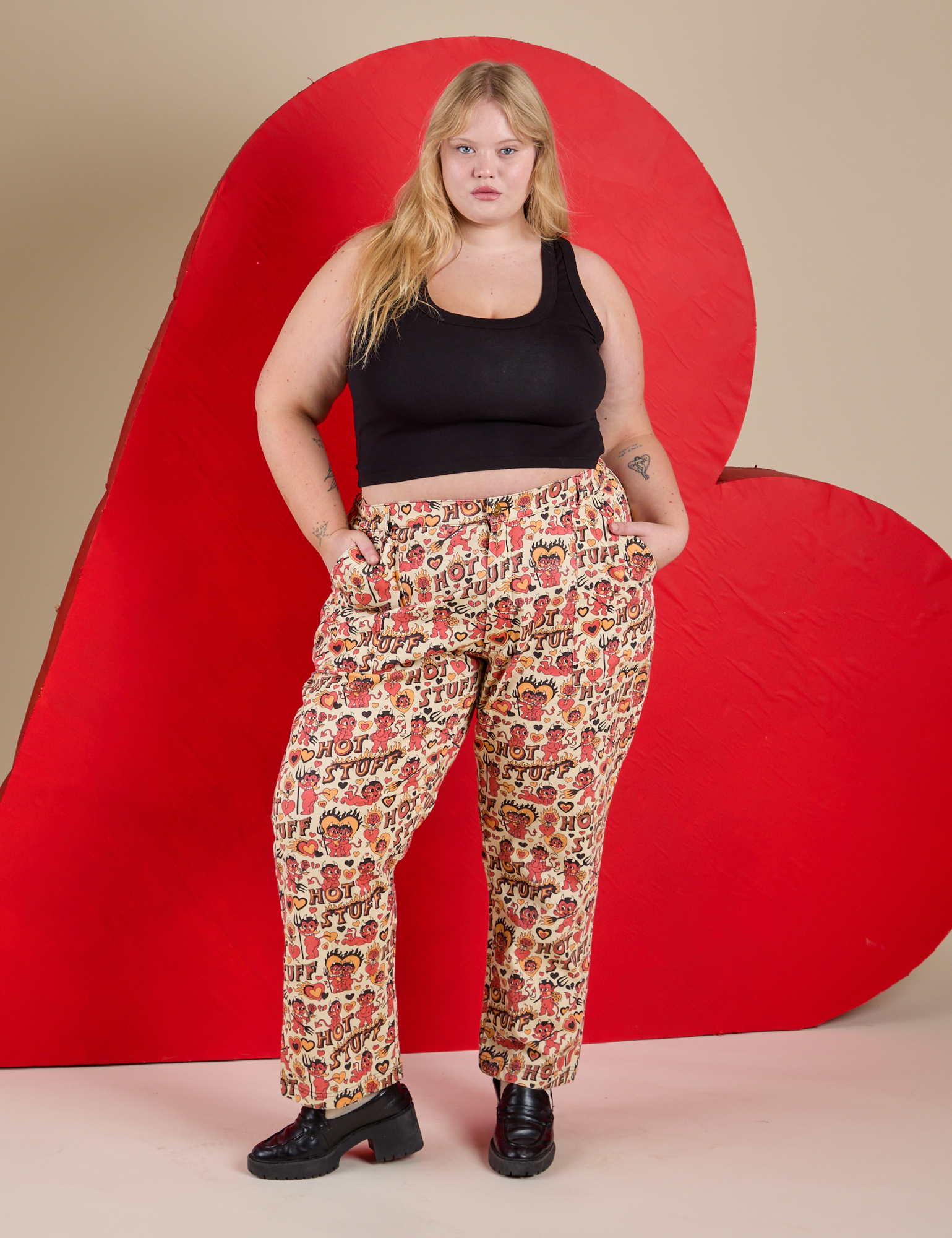 Juliet is wearing Work Pants in Hot Stuff Print and black Cropped Tank