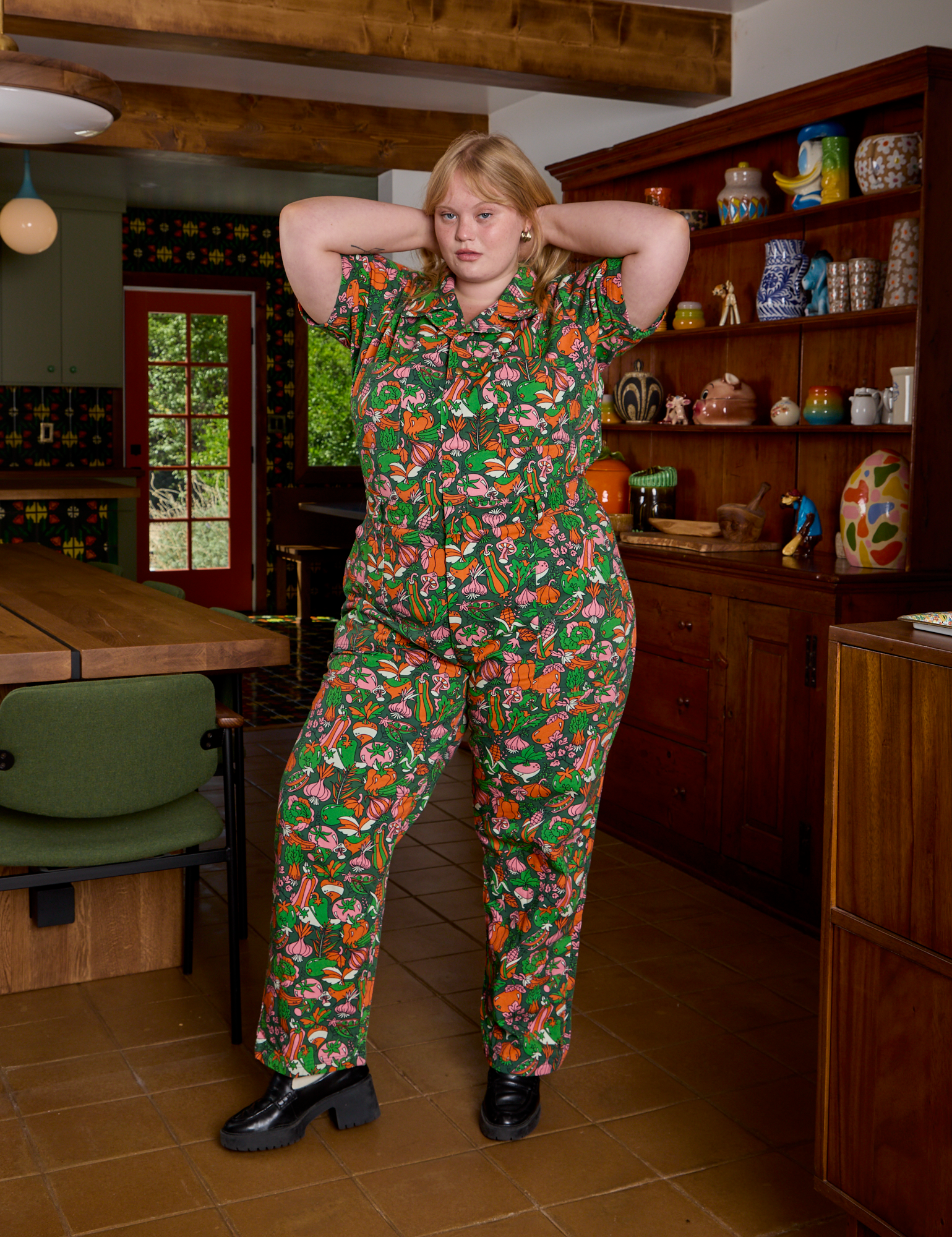 Juliet is wearing Short Sleeve Jumpsuit in Kitchen Collection