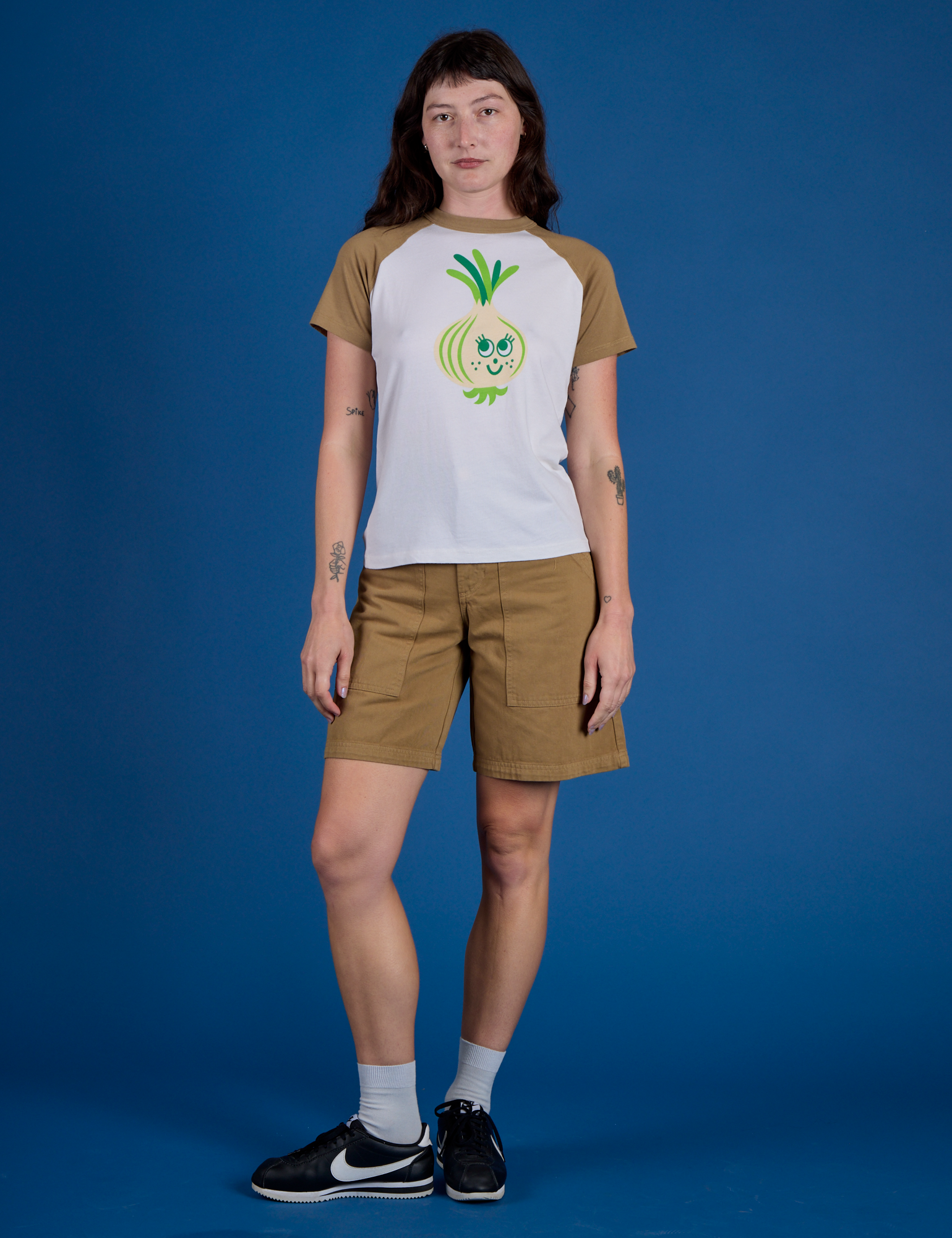 Alex is 5’8” and wearing P Produce Raglan Tee in Onion