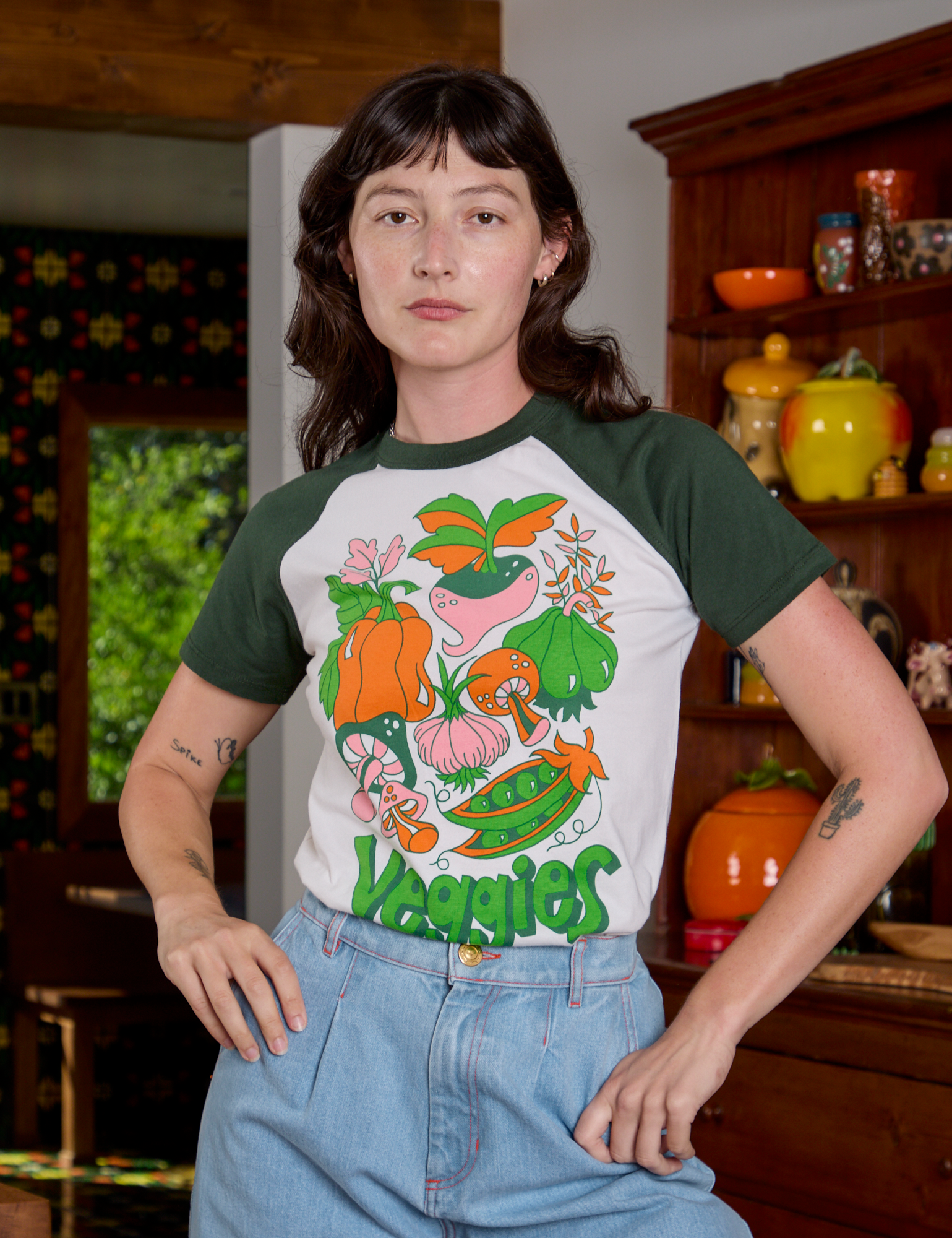 Alex is 5'8" and wearing P Short Sleeve Raglan Tee in Veggies