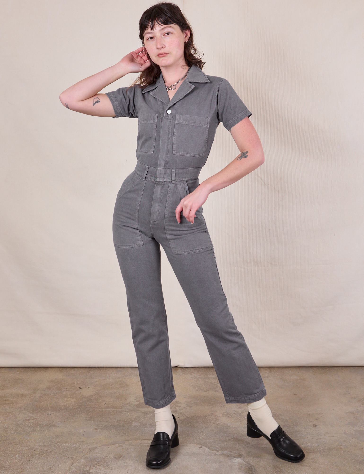 Alex is 5'8" and wearing XXS Short Sleeve Jumpsuit in Washed Grey