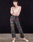Alex is 5'8" and wearing XXS Wavy Dye Work Pants paired with a vintage off-white Cropped Tank Top