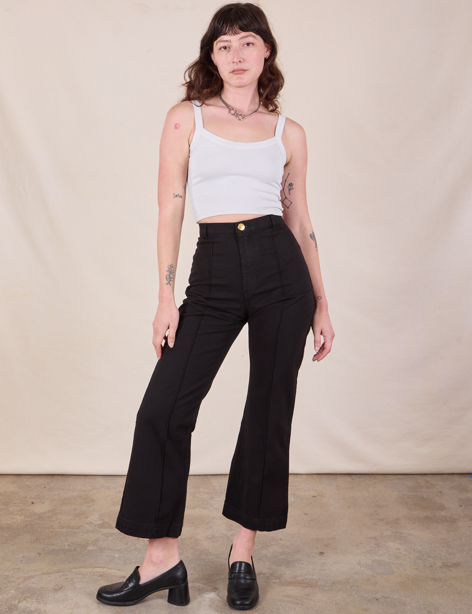 Western Pants in Basic Black and Cropped Cami in Vintage Tee Off-White worn by Alex