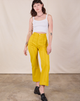 Western Pants in Golden Yellow and Cropped Cami in vintage tee off-white worn by Alex