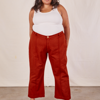 Alicia is wearing Western Pants in Paprika and a vintage off-white Tank Top