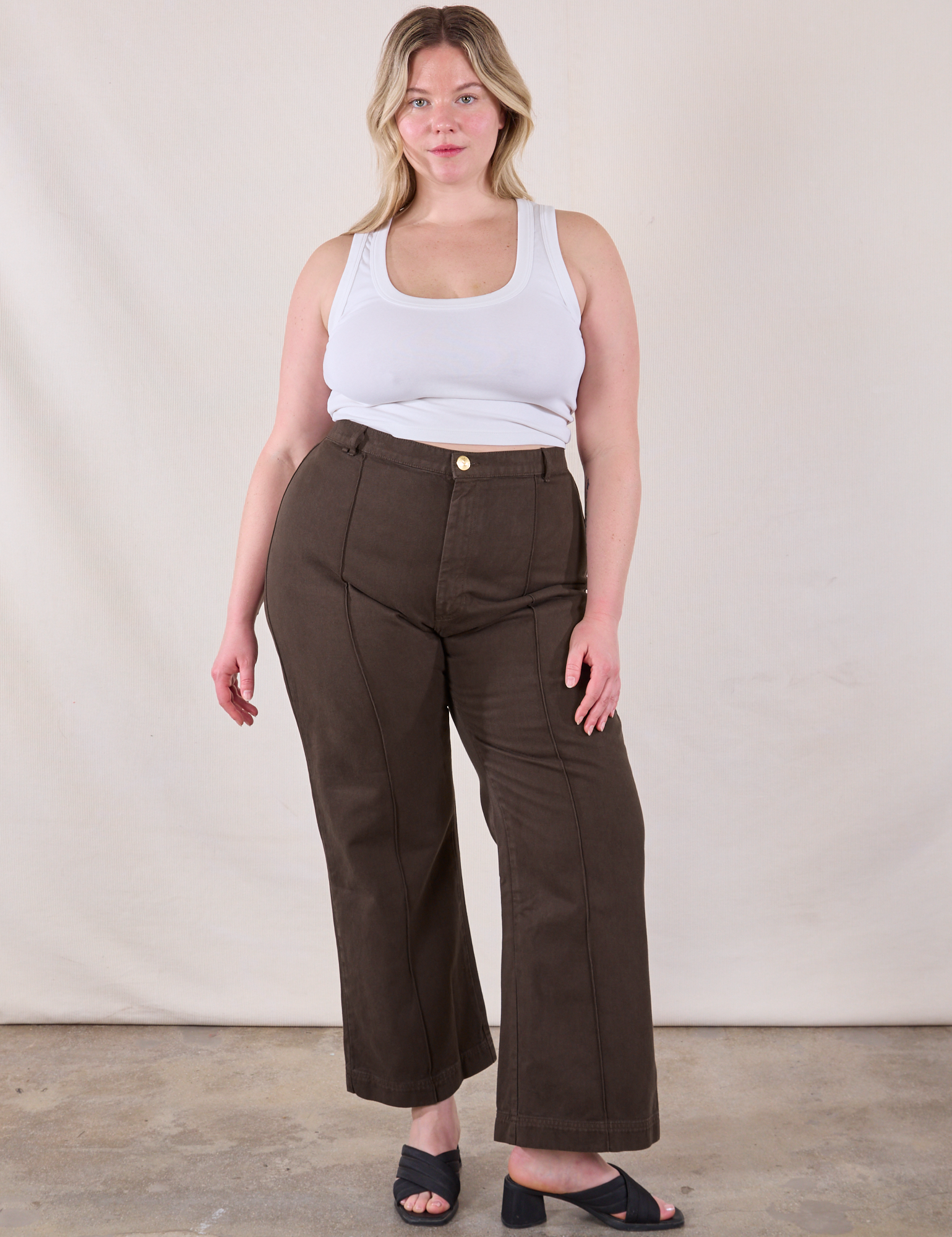 Lish is 5'8" and wearing XL Western Pants in Espresso Brown paired with a Cropped Tank in Vintage Tee Off-White